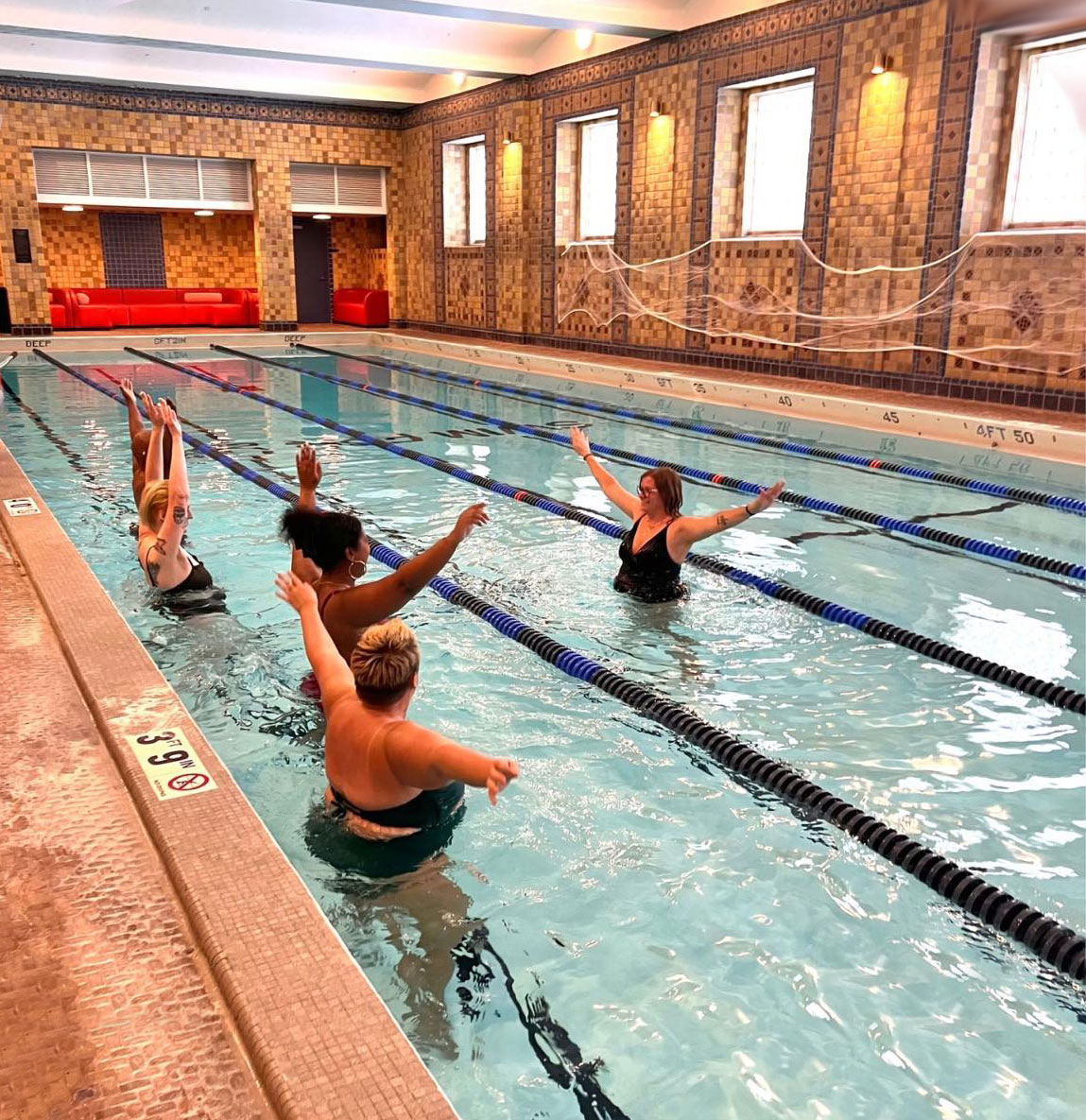 A group of women doing water aerobics at Locust Street Athletic and Swim Club